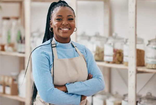 woman smiling wearing an apron